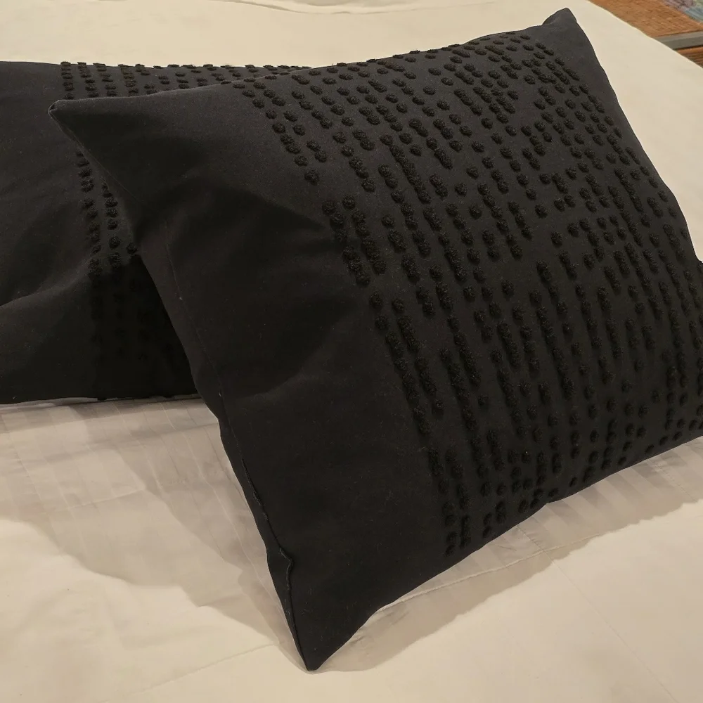 Two Black IKEA Textured Throw Pillows